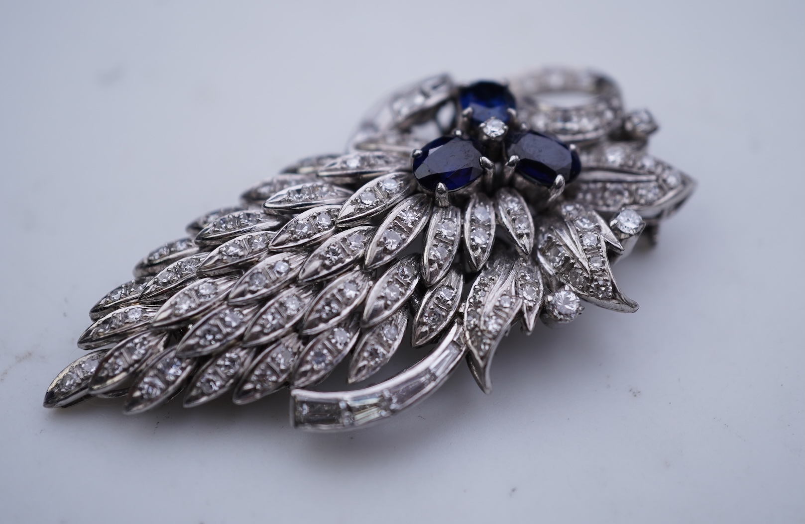 A sapphire and diamond brooch, mid 20th century